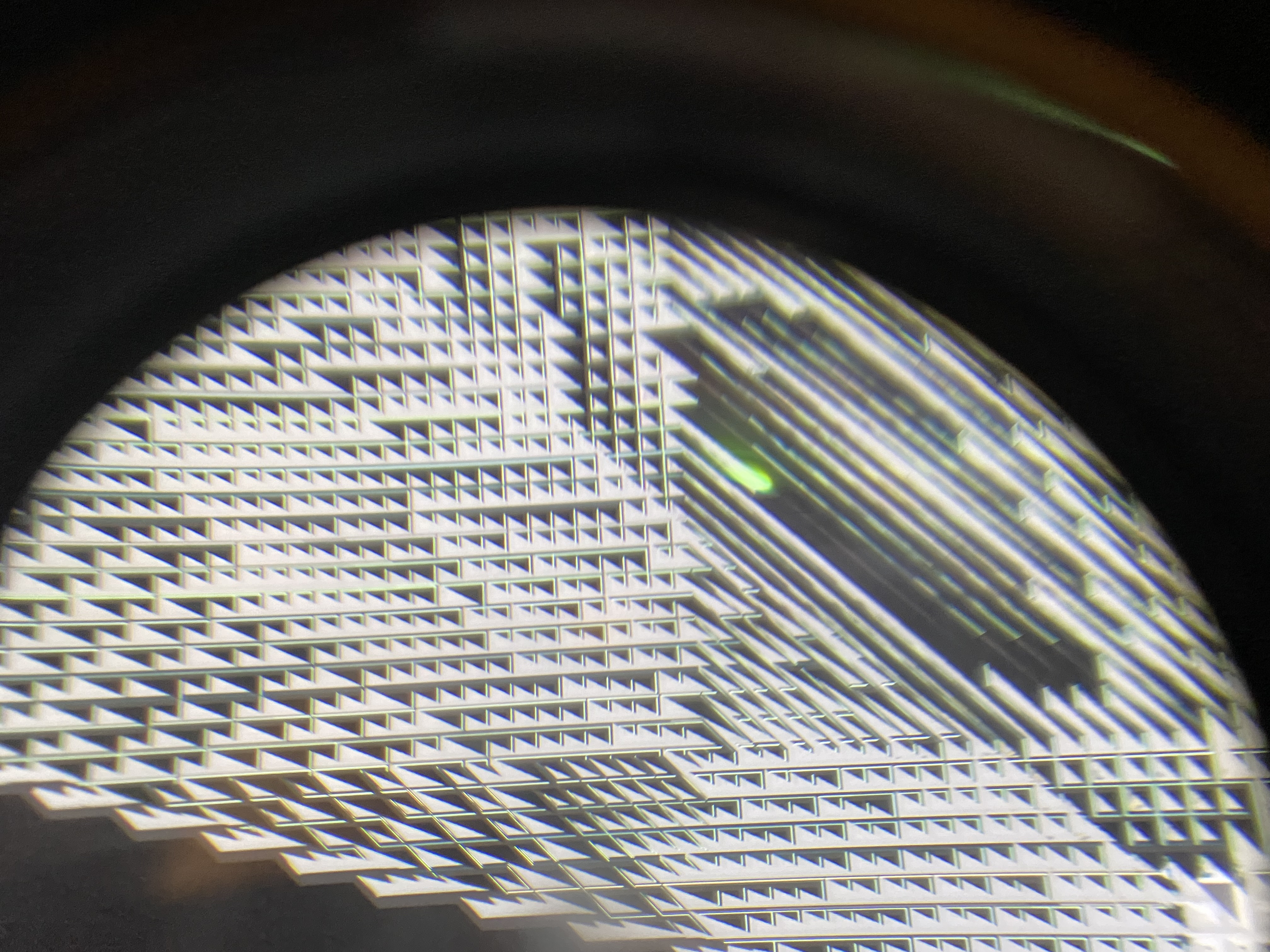 A weird repeating pattern of black and white squares seen through the lens of a VR headset.